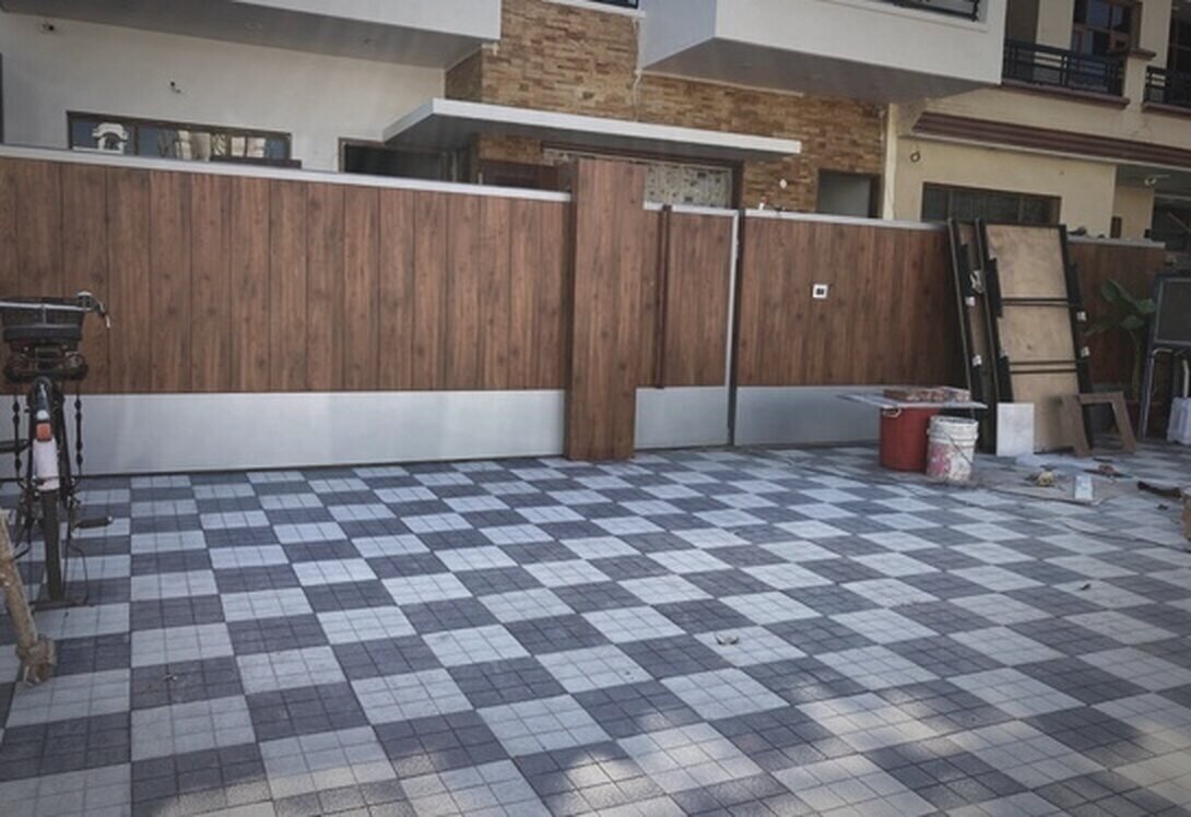 Checkered-tile courtyard with a wood-finish boundary wall