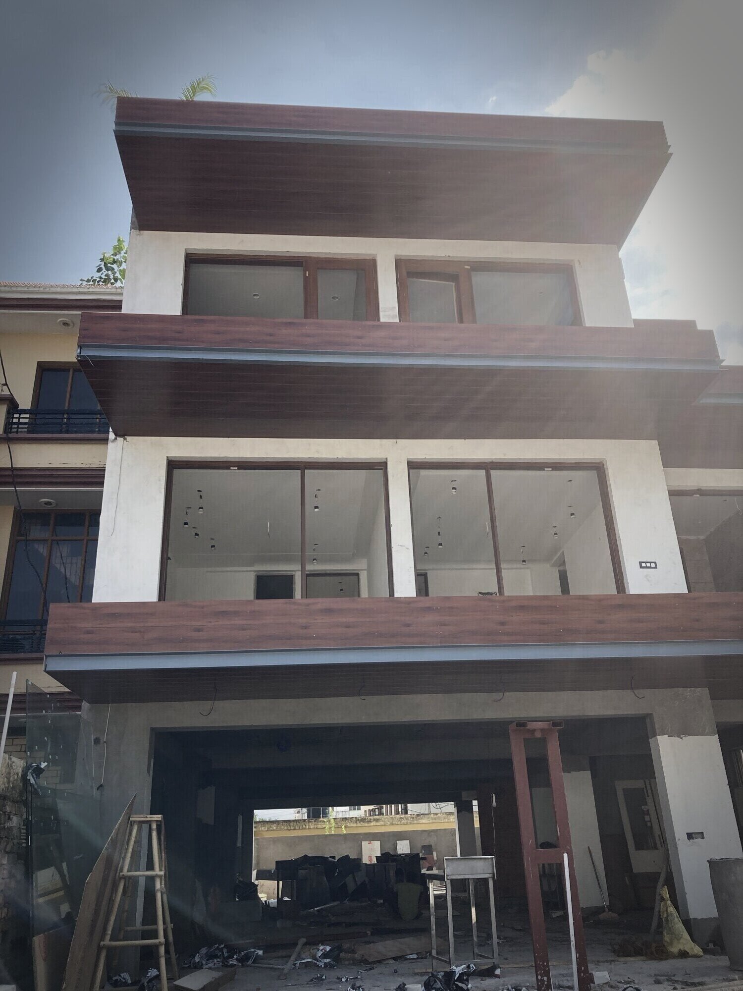 Entrance elevation with vertical wood-finish fins