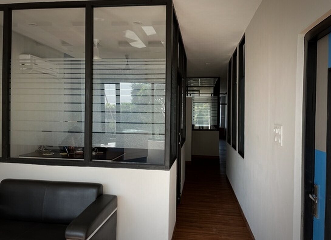 Corridor of glass-partitioned cabins