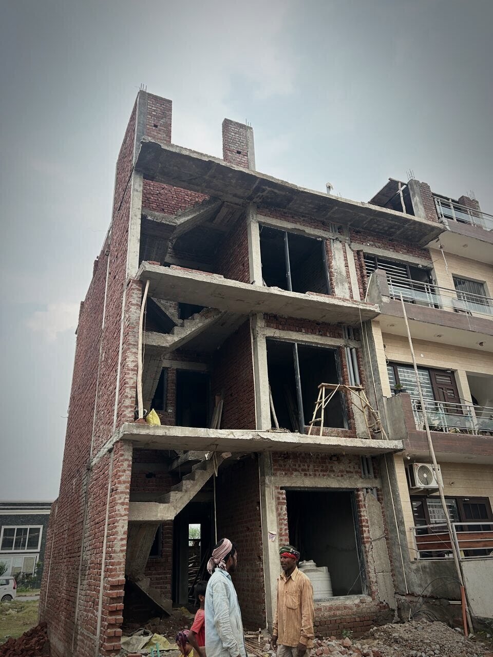 Multi-storey brick and concrete structure under construction